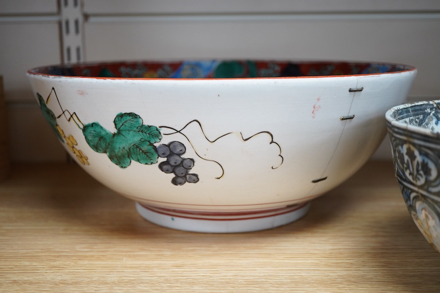 An early Persian pottery bowl and vase, a Japanese bowl and another Chinese segment dish, tallest 20cm